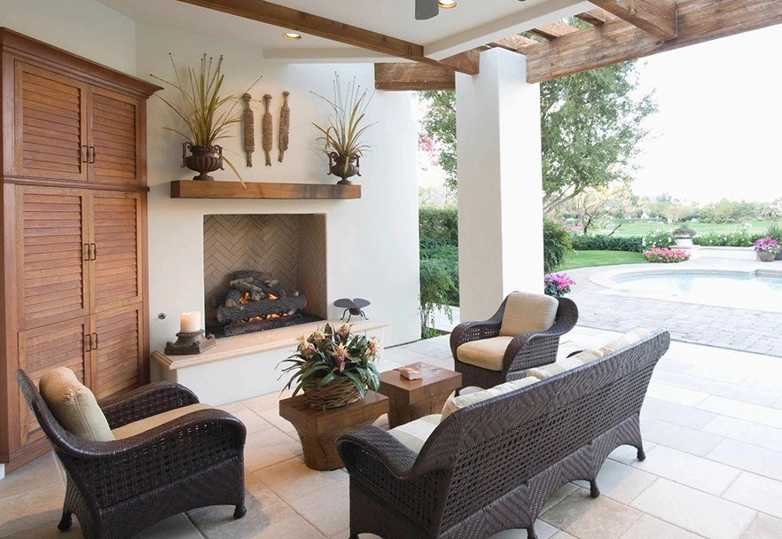 A living room with couches and chairs, fireplace.