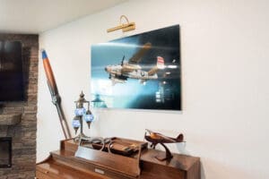 Airplane photo and model display on piano.