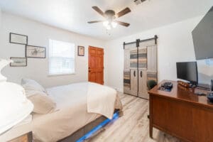Cozy bedroom with wooden furniture and decor.