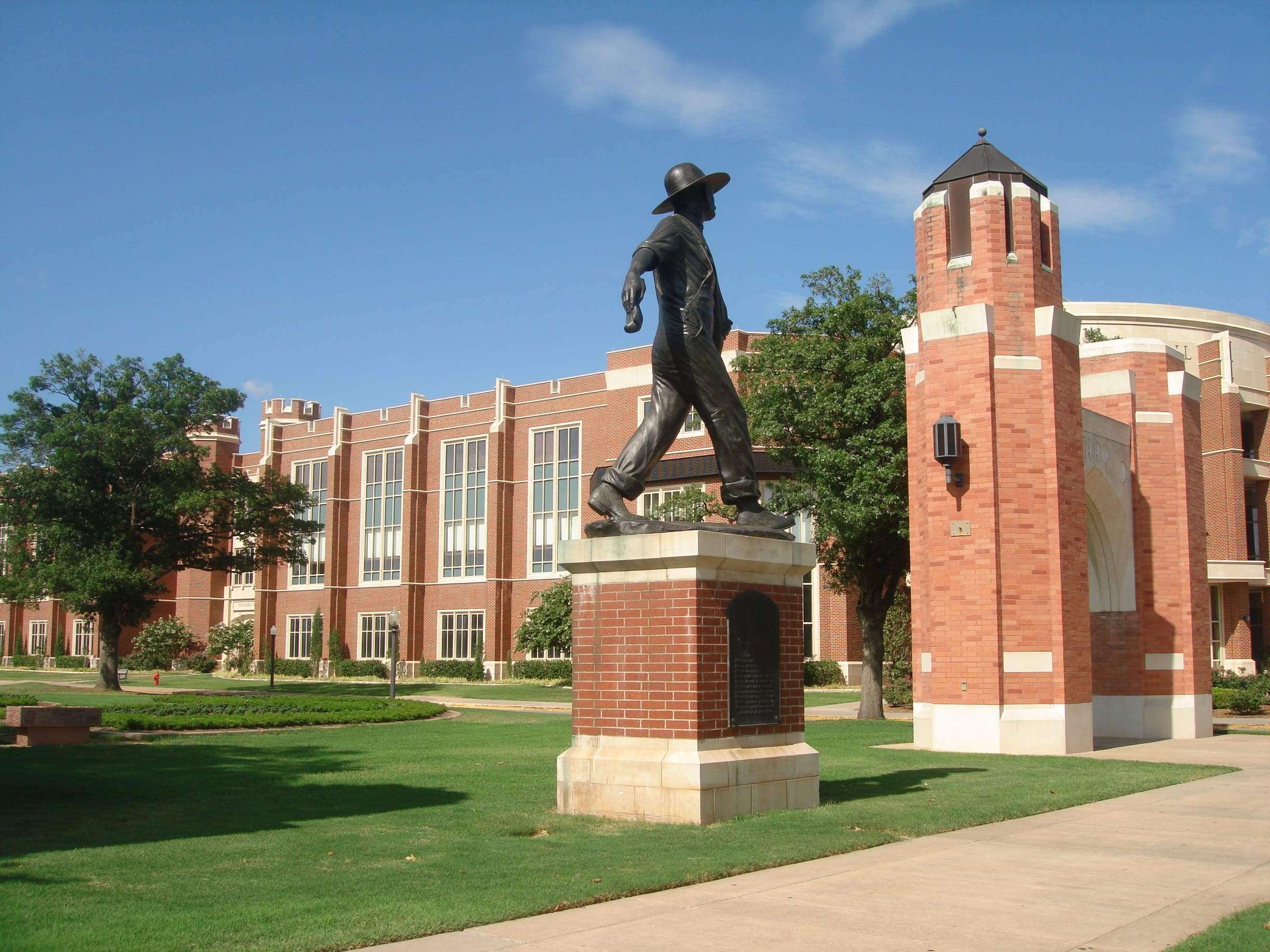 A statue of a man in front of a building.